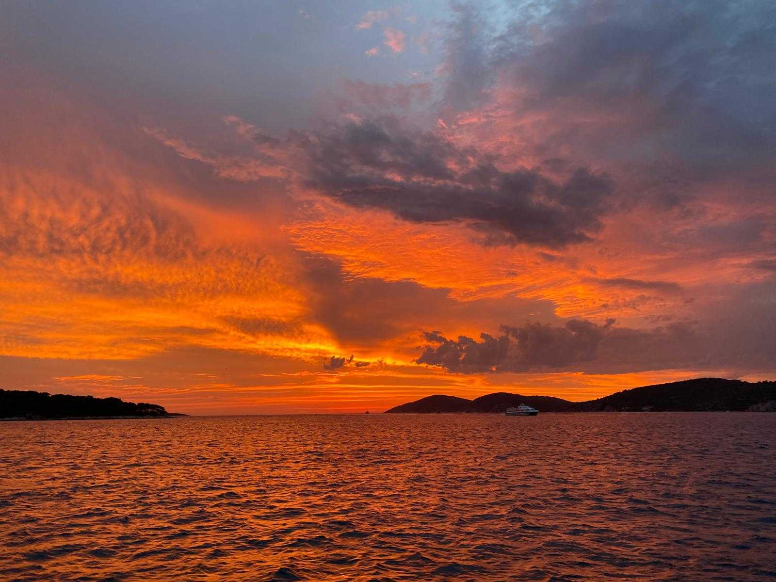 Sunset panorama over Hvar by boat